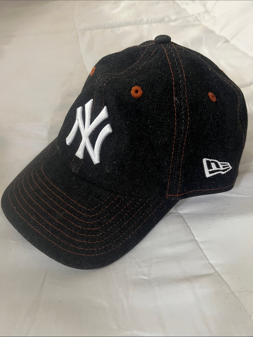 New Era  Black Cap with White NY Logo and Orange Stitching